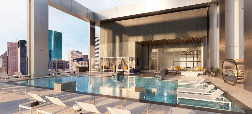 Rooftop pool with in water lounge seating, cabana seating and sunbathing lounge chairs